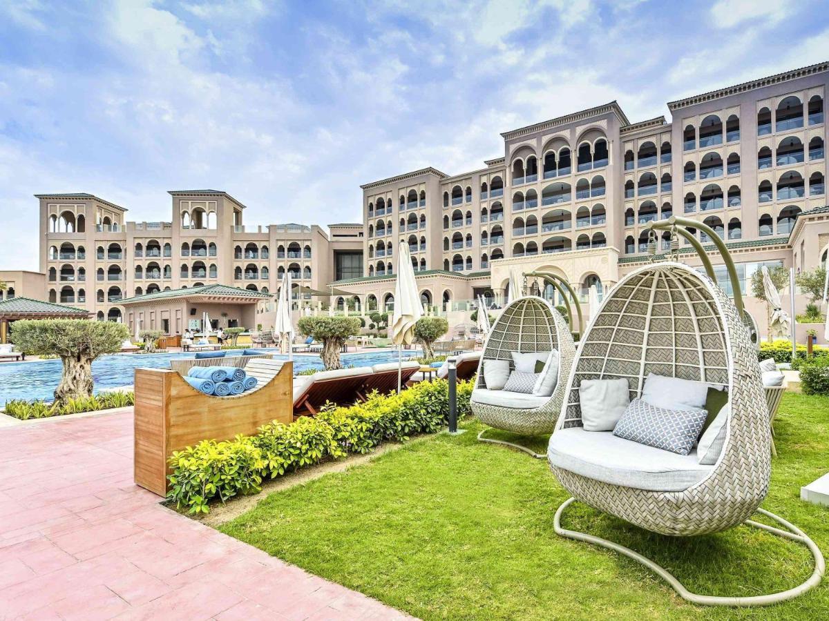Royal Saray Resort Manama Exterior photo The resort's pool area