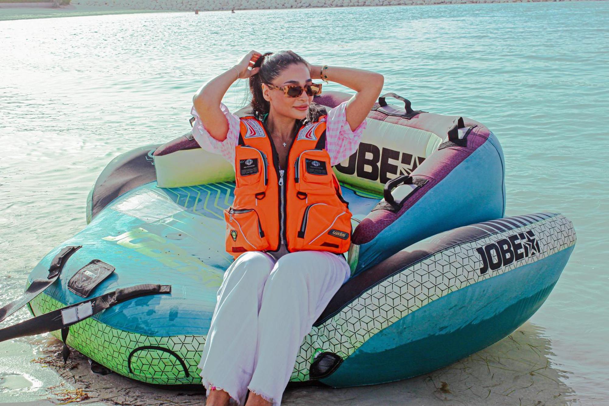 Royal Saray Resort Manama Exterior photo A woman wearing a life jacket